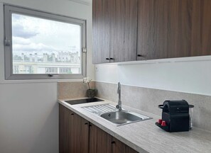 Fridge, microwave, stovetop, coffee/tea maker