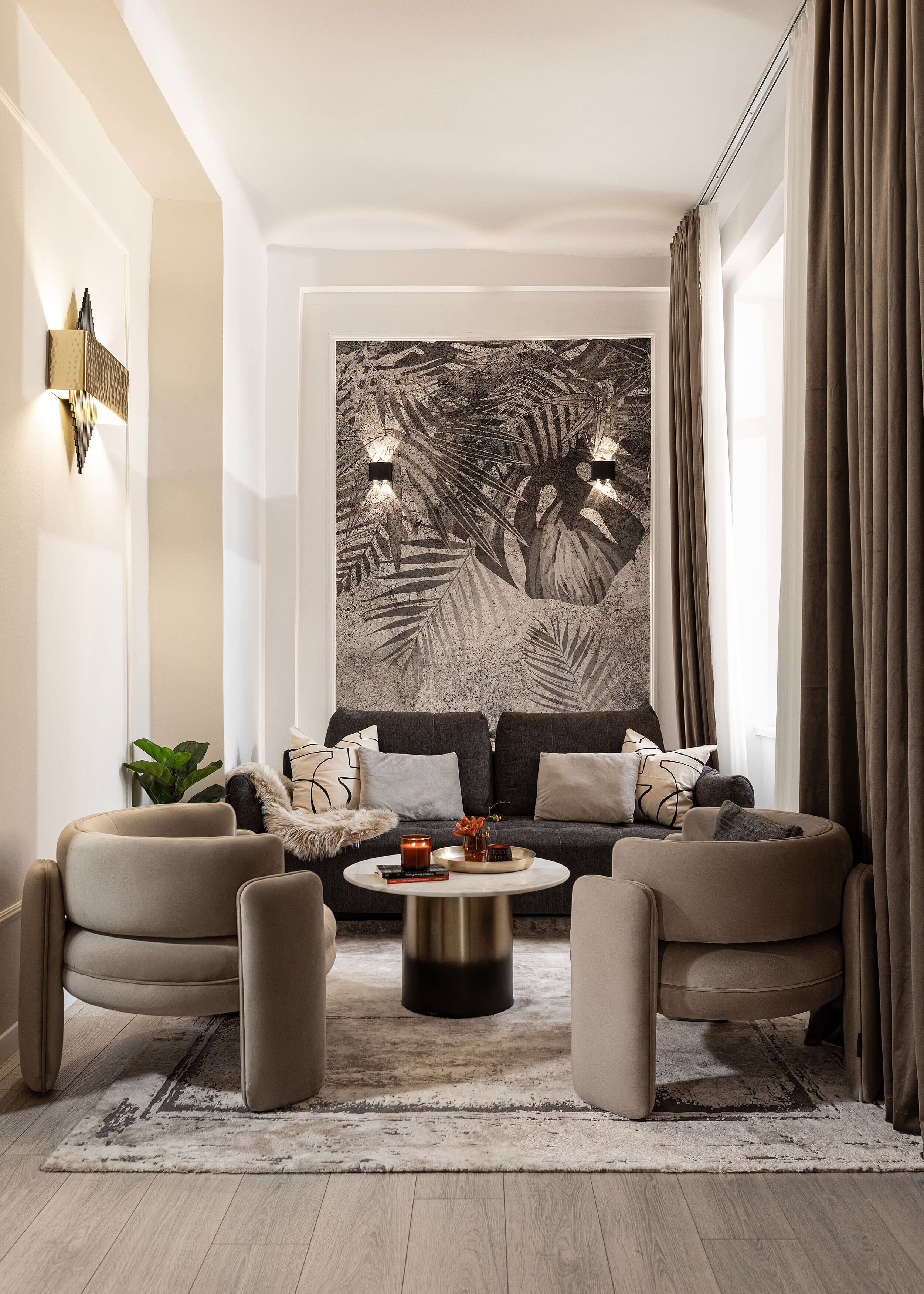 A modern living room with a large abstract painting, a sofa set, and a coffee table.