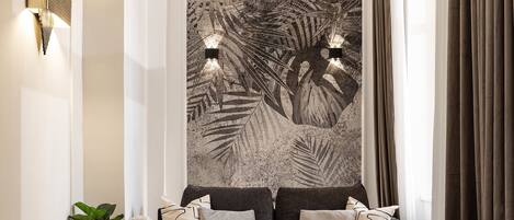 A modern living room with a large abstract painting, a sofa set, and a coffee table.