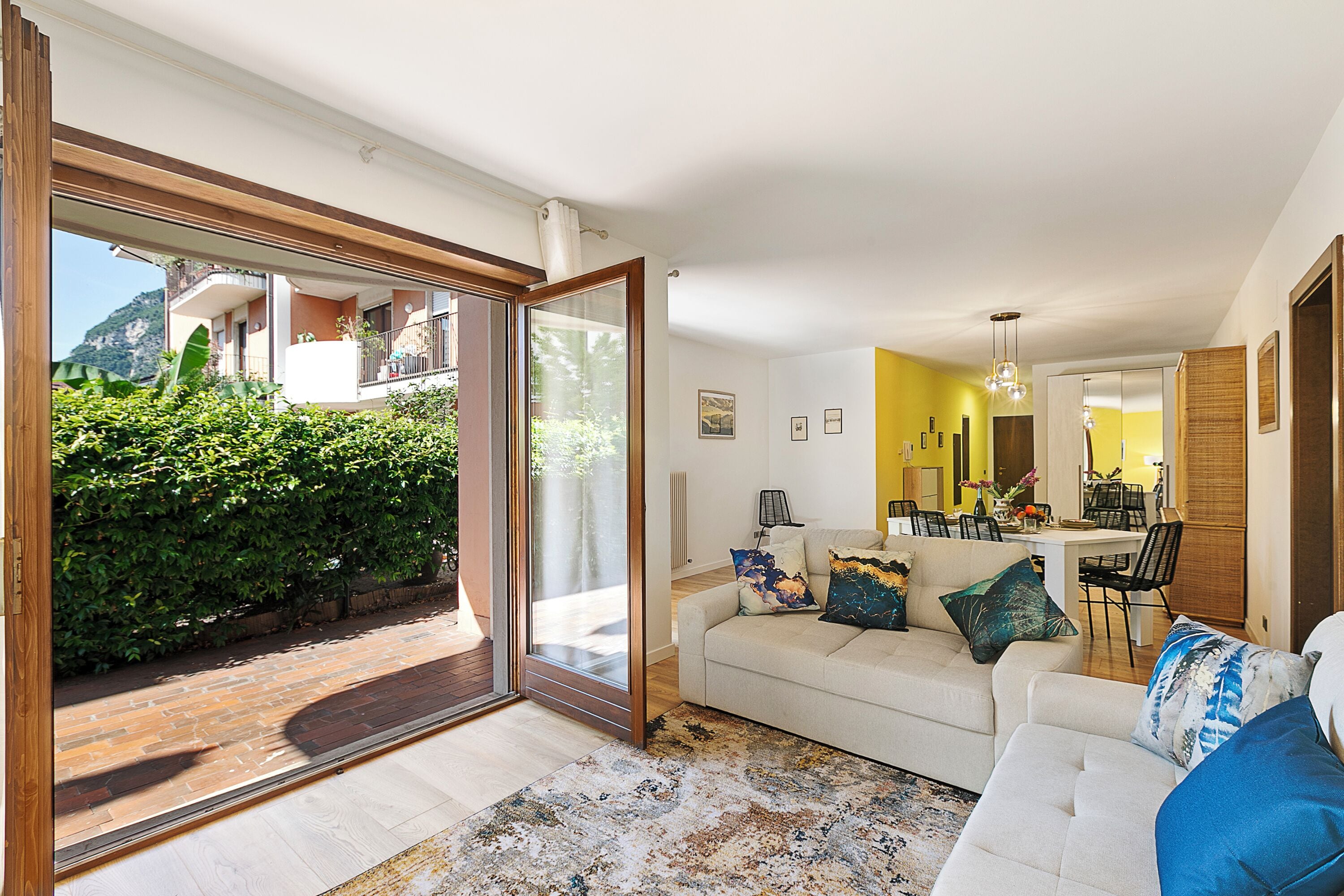 Family Apartment, Multiple Bedrooms (Il Giardino di Riva) | Living area | 21-inch flat-screen TV with cable channels, TV