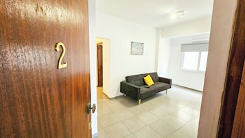 Comfort Apartment | Living area | Flat-screen TV