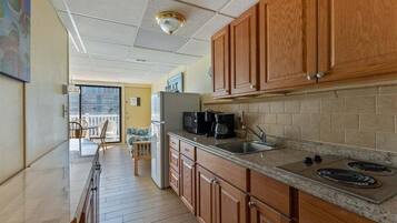 Fridge, microwave, stovetop, coffee/tea maker