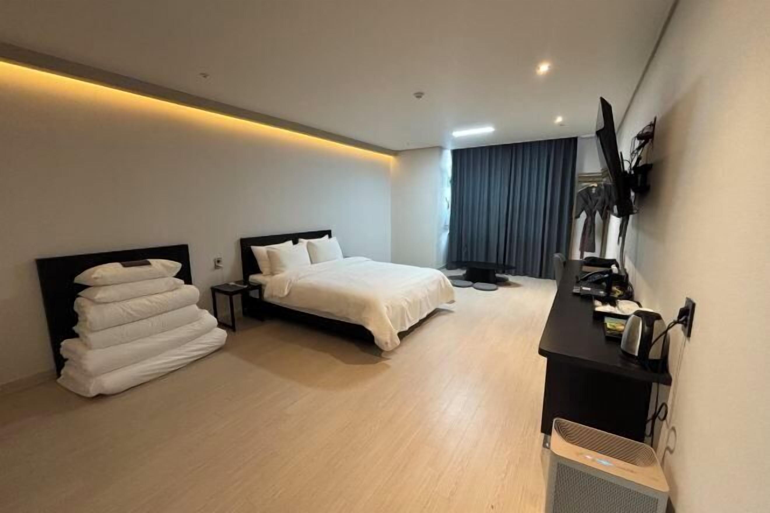 Premium bedding, memory foam beds, free minibar, desk