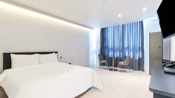 Premium bedding, memory foam beds, free minibar, desk