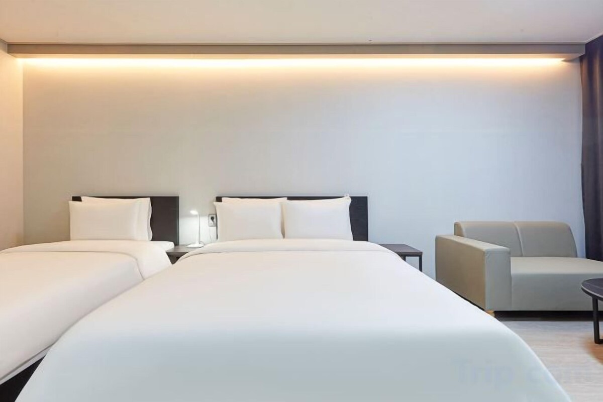 Premium bedding, memory foam beds, minibar (free items), desk