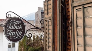 A sign for "Tabak Trafik" hanging from a building.