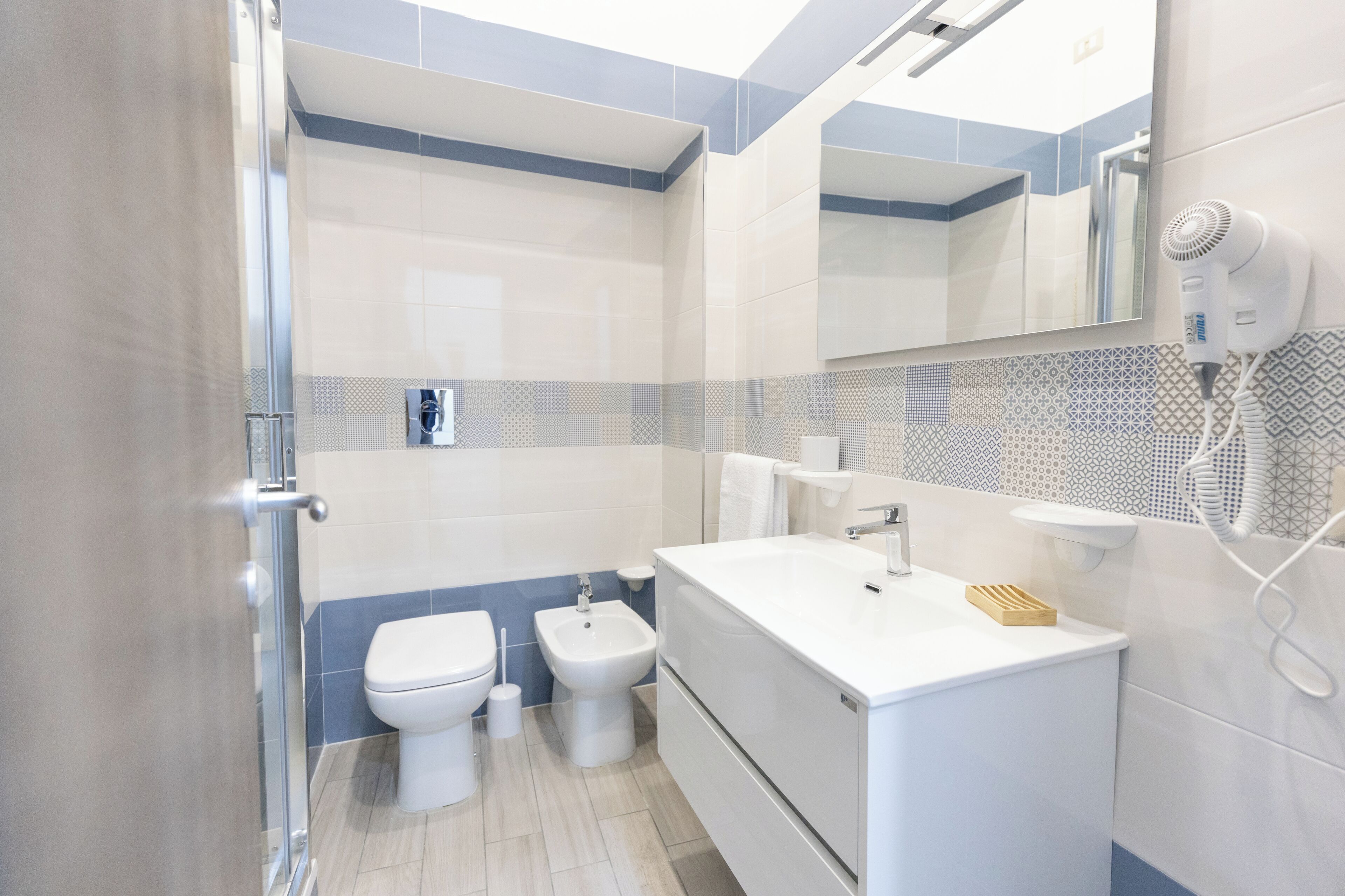 Deluxe Double Room, Balcony, City View | Bathroom | Eco-friendly toiletries, hair dryer, slippers, towels