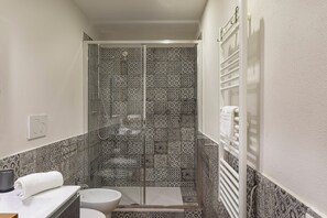 Basic Apartment, City View | Bathroom | Shower, hair dryer, towels, soap