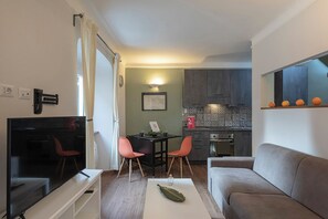 Basic Apartment, City View | Living area | 35-inch TV with digital channels