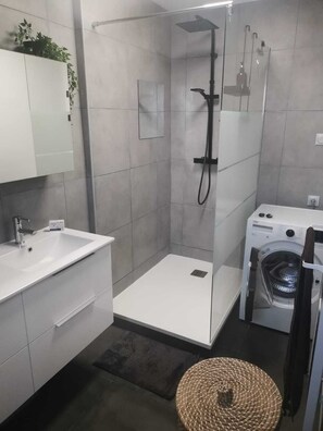 Shower, hair dryer, towels, soap