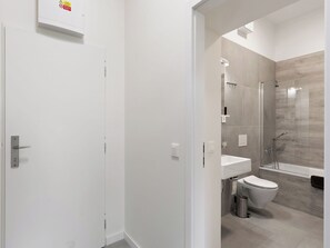 A modern bathroom with a shower, toilet, and sink. - Javorná Lodge by Interhome (Javorná)