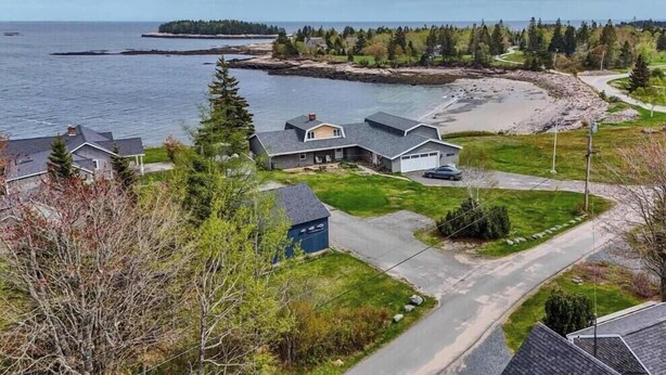 A coastal residential area with houses, a beach, and a view of the sea. - Sand Cove Cottage-New! (Gouldsboro)