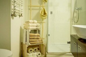 Shower, hair dryer, towels, soap