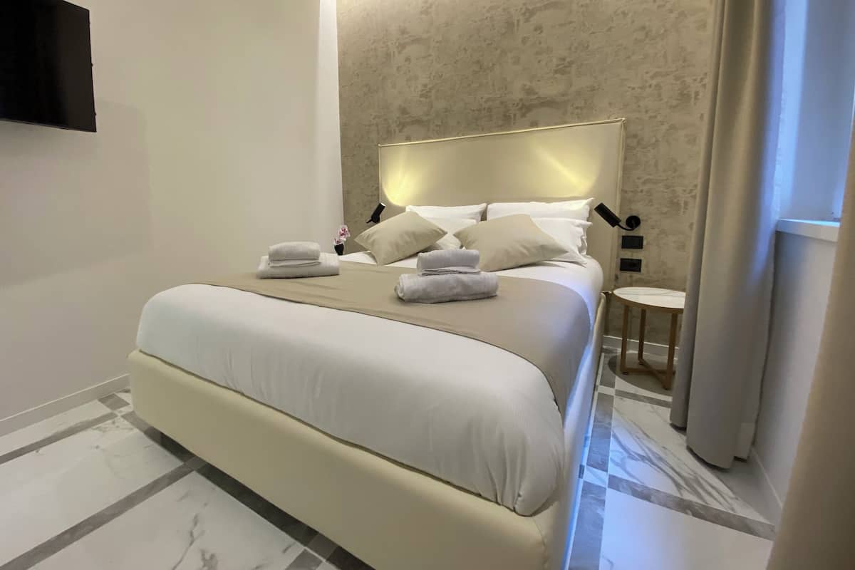 Premium bedding, down duvets, memory-foam beds, in-room safe
