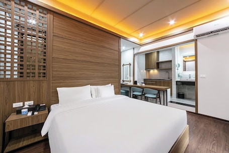 Junior Suite | Private kitchen | Mini-fridge, paper towels. A25 Hotel - 21 Nghia Tan