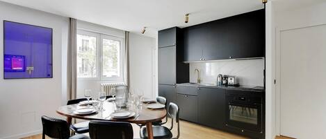 Fridge, microwave, stovetop, coffee/tea maker