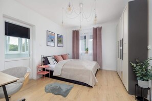 1 bedroom, desk, iron/ironing board, travel crib