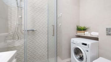 Shower, hair dryer, towels, shampoo