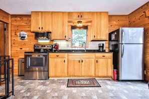 Fridge, microwave, oven, stovetop - Stepaway Vacation Rentals- West Bay Getaway (St. Germain)