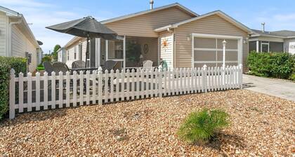 Discover Relaxation and Fun in a Charming Patio Villa with a Golf Cart!