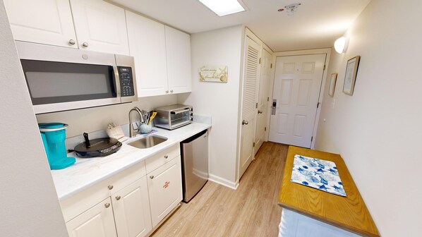 Fridge, microwave, stovetop, coffee/tea maker