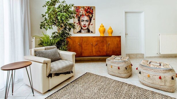 A living room with a sofa, a coffee table, a cabinet, and two ottomans. - Chania Paradise Retreat-falasarna Villa Nostalgia (Kissamos)