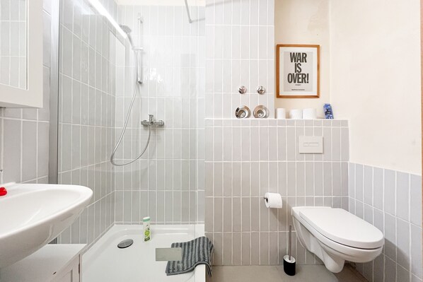 Shower, hair dryer, towels, soap