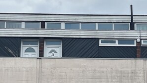 A multi-story building with a flat facade, large windows, and a visible number '40' on the second floor. - Cosy Flat for 1-3 not far From City Centre (Leicester)