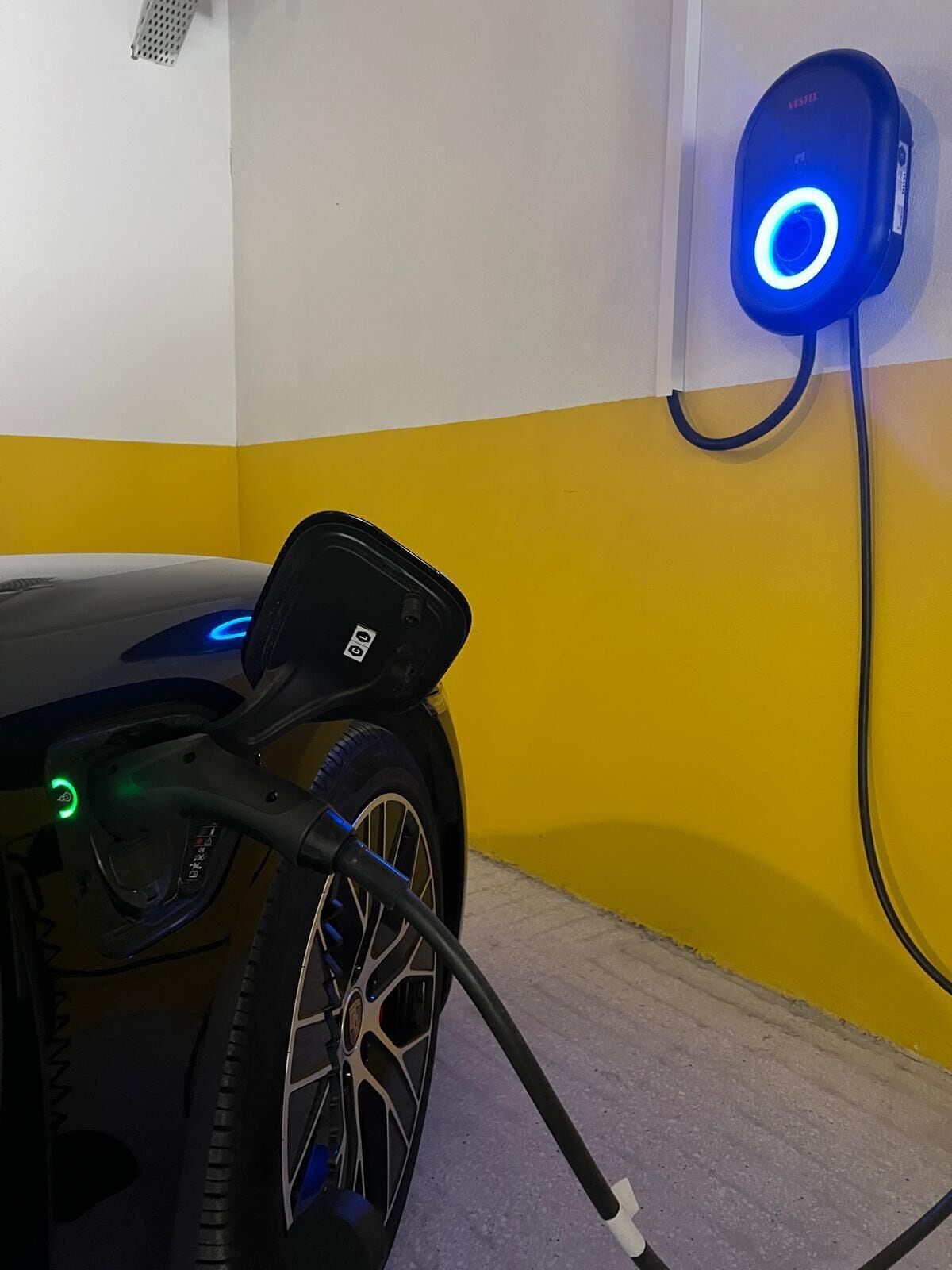 A charging station with a car connected to it.
