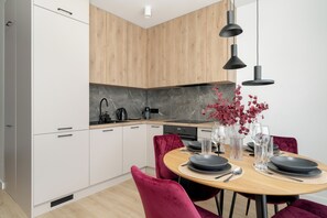 Apartment, 1 Bedroom, Balcony | Private kitchenette | Oven, dishwasher, coffee/tea maker, electric kettle - Apartment in a Green Area by Renters (Poznan)