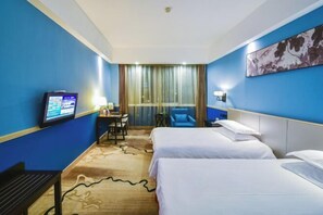A hotel room with two beds, a desk with a computer, a chair, and a TV. - Taizhou Sanyou International Hotel (Shili Changjie) (Taizhou)