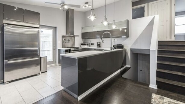 A modern kitchen with a large island, stainless steel appliances, and pendant lighting. - Executive / Family Home | 2 BR • Office • Parking • 10mins to Toronto or Pearson (Mississauga)