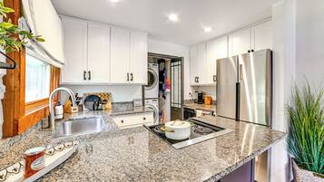 Fridge, stovetop, dishwasher, coffee/tea maker
