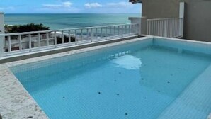 A swimming pool with a view of the ocean. - Family-Friendly 3BR Beachfront Puntarena (Rio Hato)