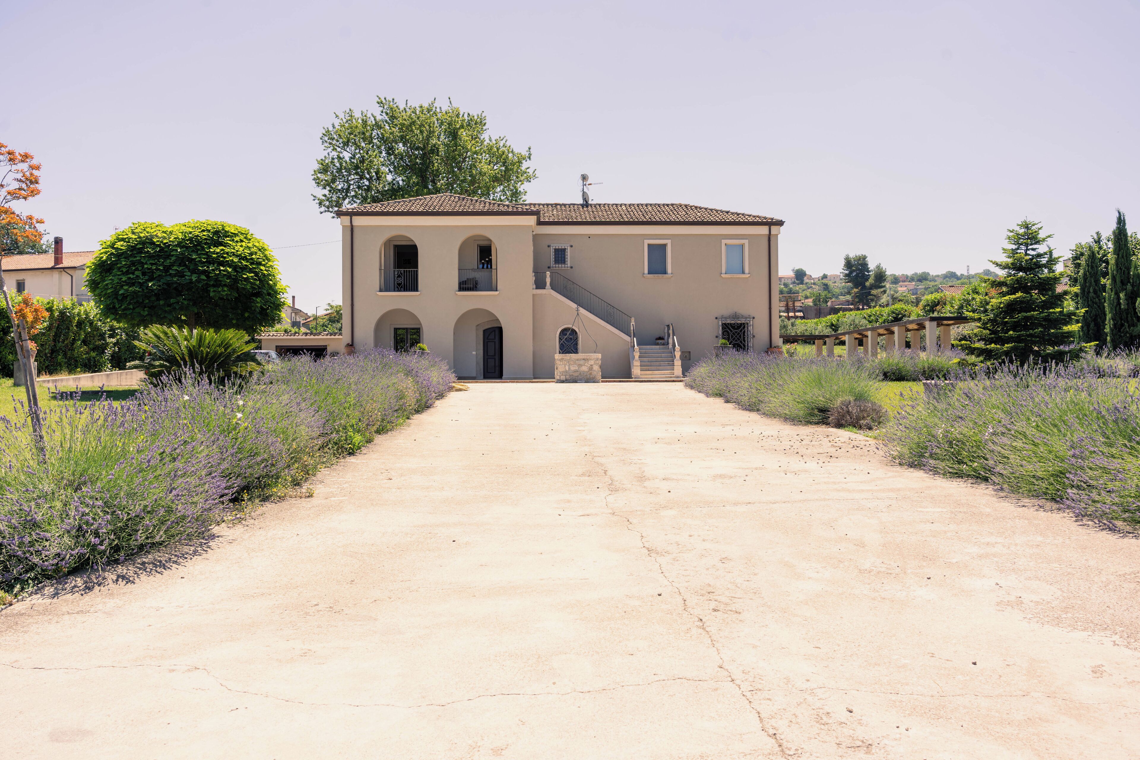 A two-story building with a central staircase leading to the entrance.