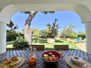 Enjoy a leisurely meal amidst the serene garden views.