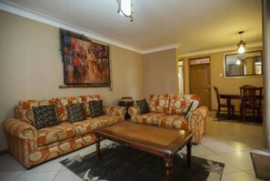 Superior Apartment, Balcony, City View | Living area | TV - Castle Apartments Kampala (Kampala)