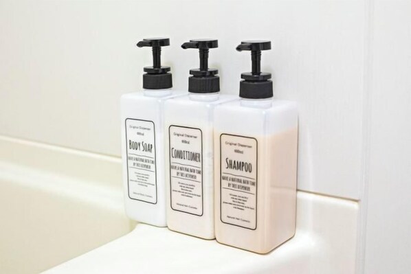Three bottles of body soap, conditioner, and shampoo on a white surface. - Daikoku Apartment 602 - Namba Apt3 minJR Imamiya/Daikokucho St/Veranda (Osaka)