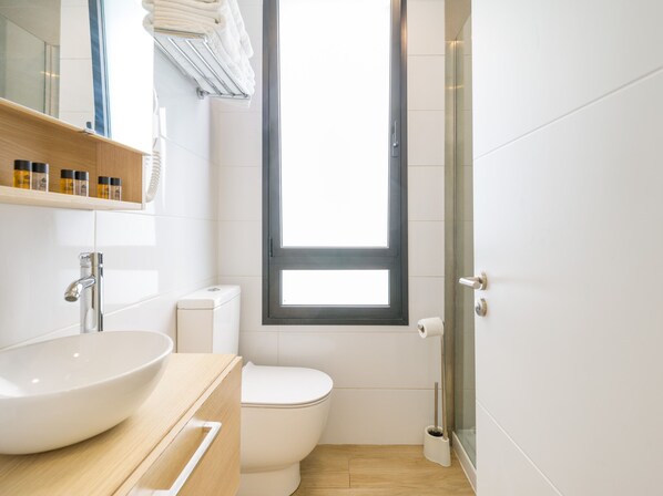 Shower, hair dryer, towels, toilet paper