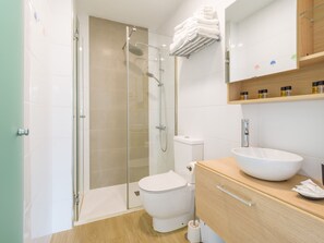 Shower, hair dryer, towels, toilet paper