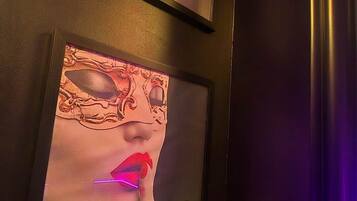 Two framed artworks on a wall.