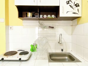 Deluxe Apartment | Private kitchen | Full-size fridge, stovetop, dining tables - Warm And Cozy 2Br Mutiara Bekasi Apartment (Bekasi)