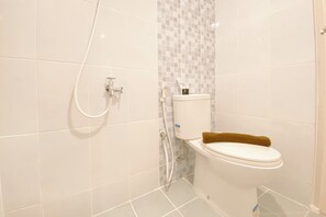 Departamento Deluxe | Baño | Regadera y toallas
