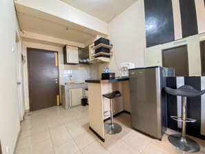 Deluxe Apartment | Private kitchen | Fridge, stovetop, dining tables, kitchen islands - Nice 2Br At Apartment Suites @Metro (Bandung)