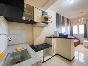 Deluxe Apartment | Private kitchen | Fridge, stovetop, dining tables, kitchen islands - Nice 2Br At Apartment Suites @Metro (Bandung)