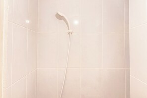 Deluxe Studio | Bathroom | Shower, towels - Simply Studio Apartment At Tokyo Riverside Pik 2 (Teluknaga)