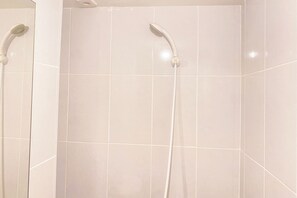 Deluxe Studio | Bathroom | Shower, towels - Cozy Living Apartment Studio At Tokyo Riverside Pik 2 (Teluknaga)