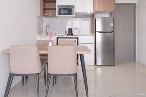 Deluxe Apartment | Private kitchen | Full-sized fridge, microwave, stovetop, dining tables - Comfortable And Homey 1Br Tamansari Bintaro Mansion Apartment (South Tangerang)