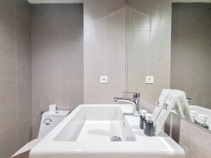 Deluxe Studio | Bathroom - Homey And Minimalist Studio At Patraland Amarta Apartment (Ngaglik)