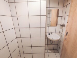 Deluxe Studio | Bathroom | Shower, towels - Modern And Comfy Studio (No Kitchen) At The City Square Apartment (Surabaya)